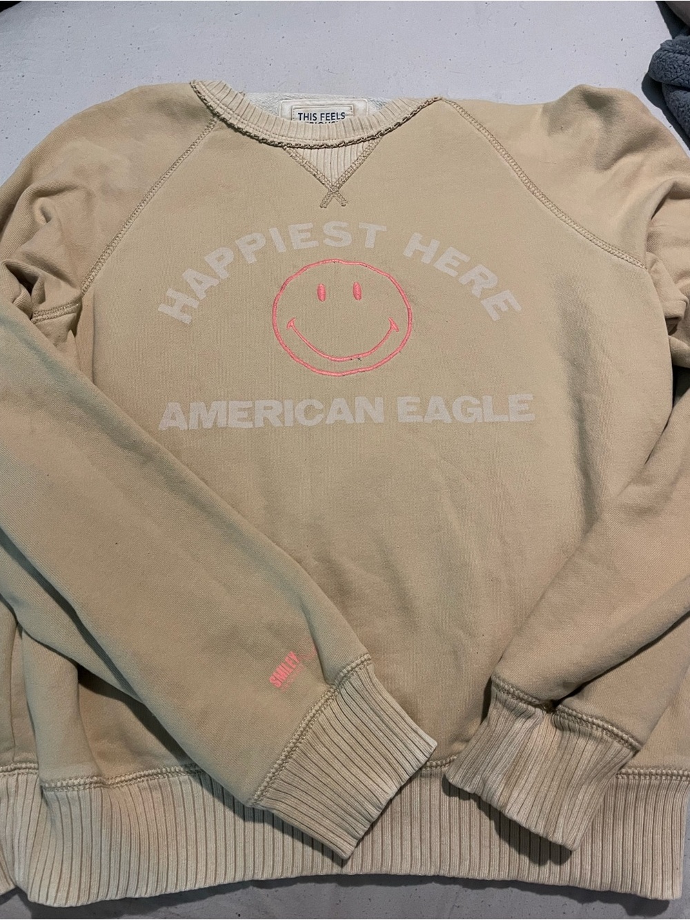 American Eagle Outfitters Men’s Cream Crewneck with Pink Smiley Graphic